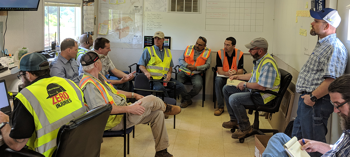 construction workers sitting in group